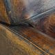 Dark brown design armchair made of sheepskin leather