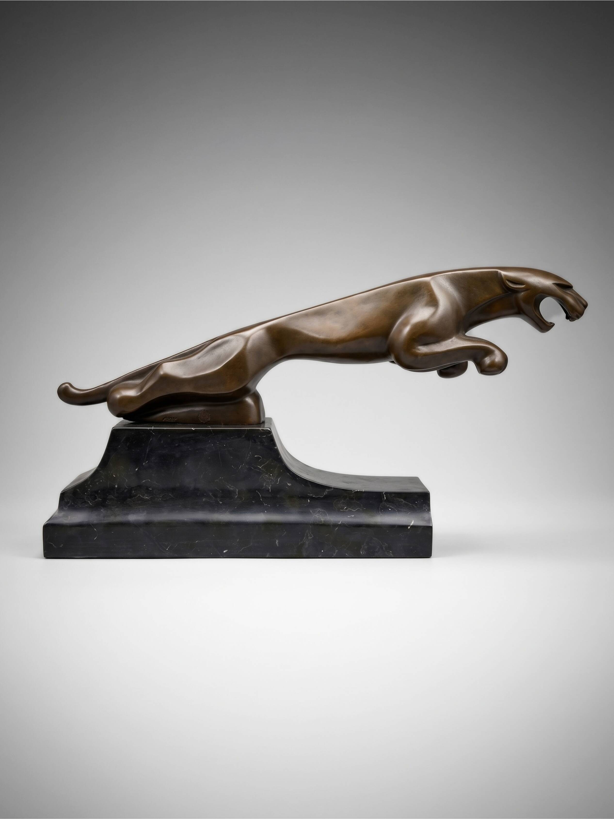Large Art Deco bronze patinated Jaguar sculpture on an architectural base.