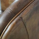 Beautiful vintage sheep leather armchair with a characterful appearance