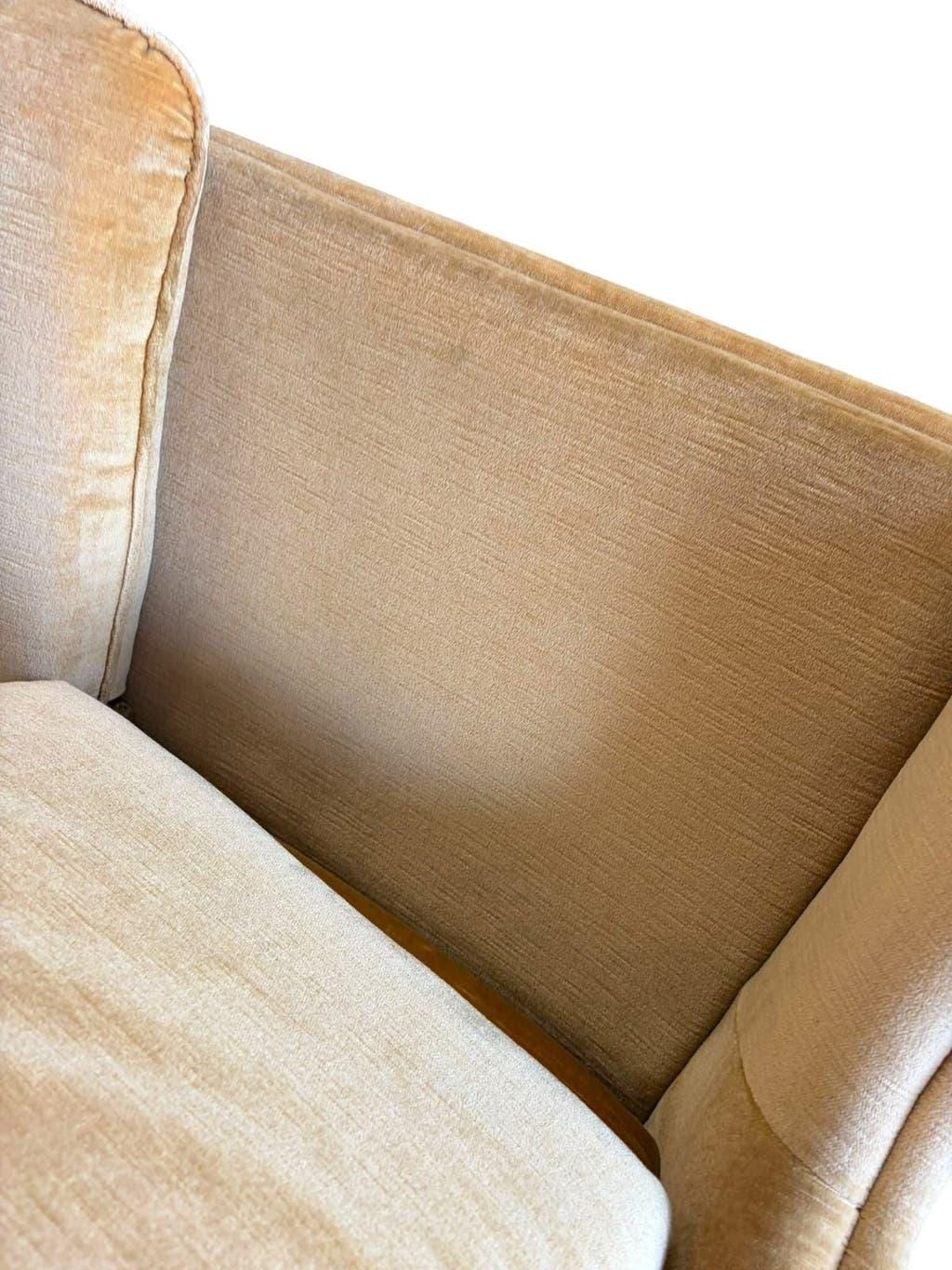 Vintage beige two-seater sofa with fringes