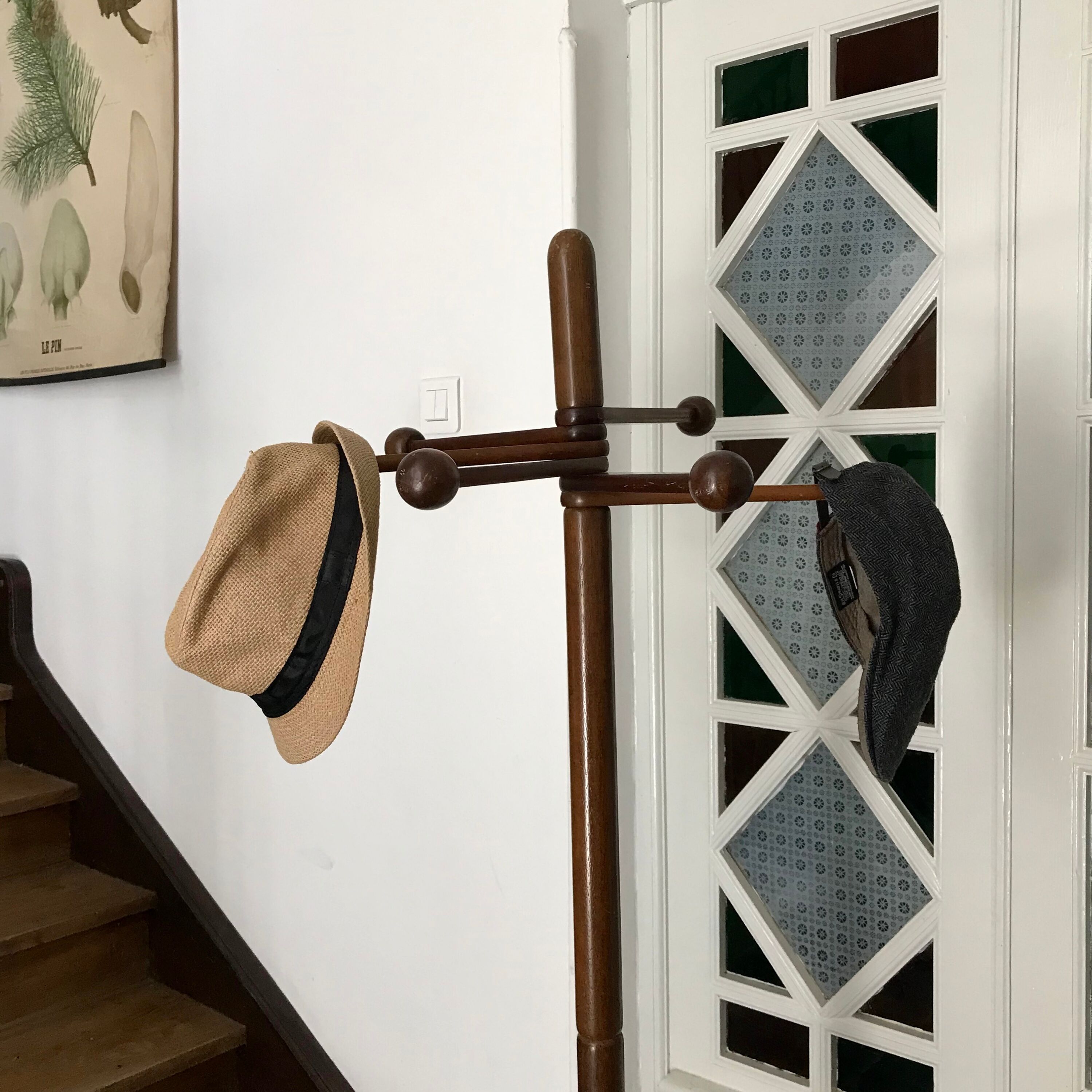 Wooden coat rack on foot
