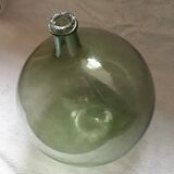 Old blown glass demijohn