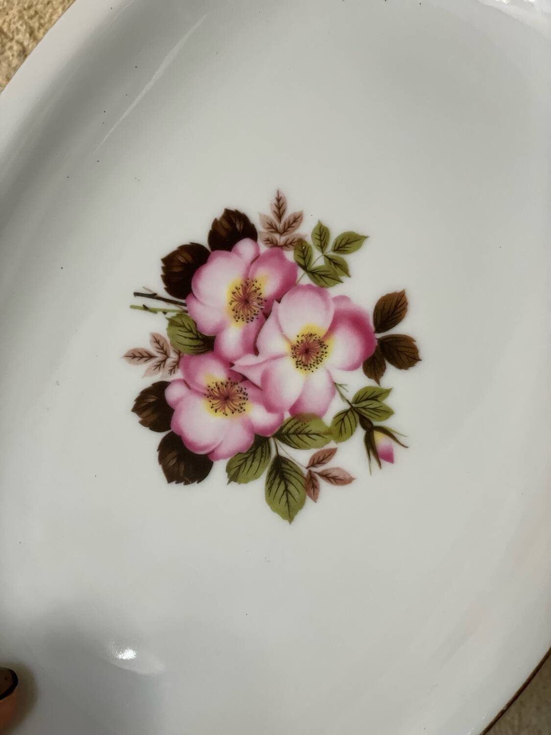 2 oval porcelain dishes with a floral pattern