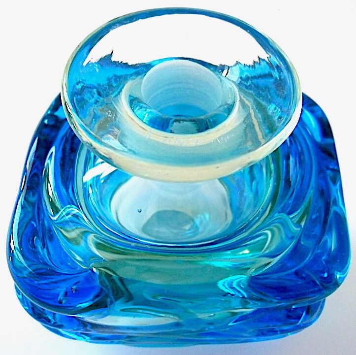 Blown blue glass bottle with inclusions