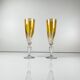 Yellow colored crystal champagne coupe duo