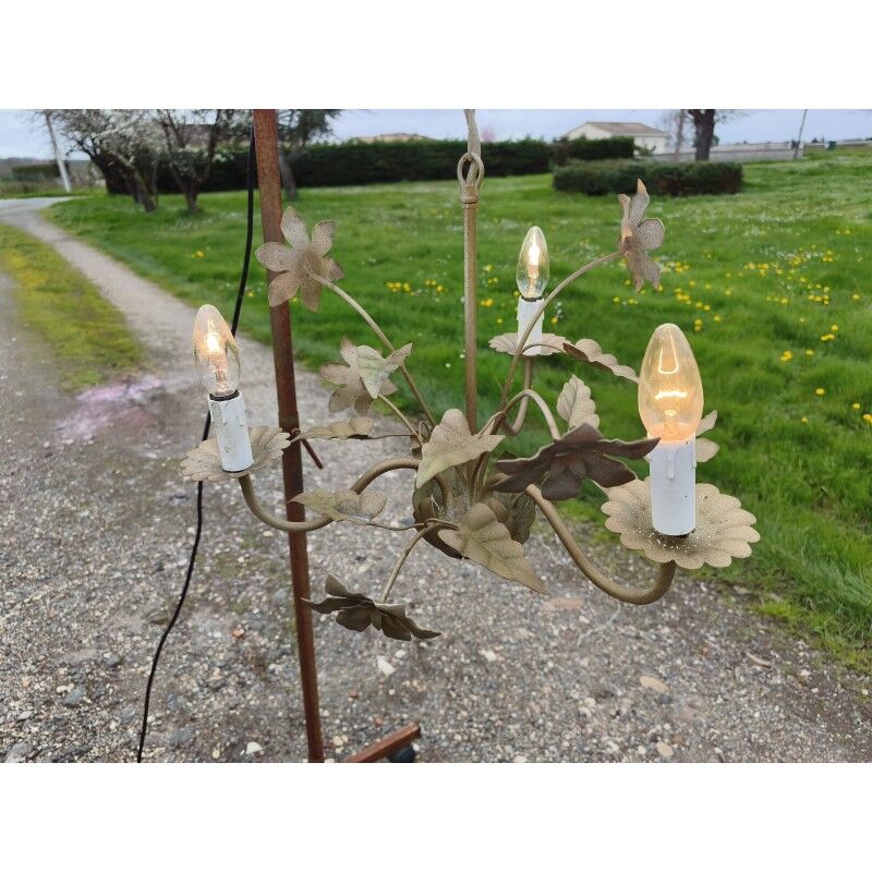 Vintage gold metal chandelier with floral decoration.