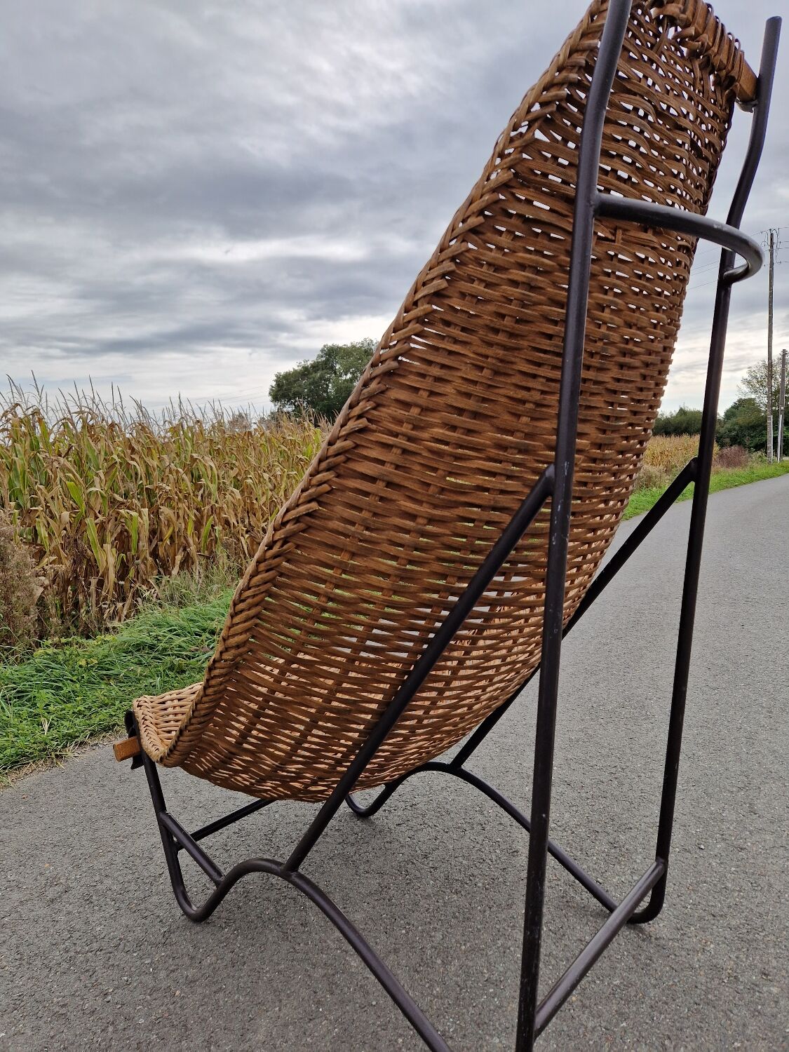 Large vintage metal and wicker armchair
