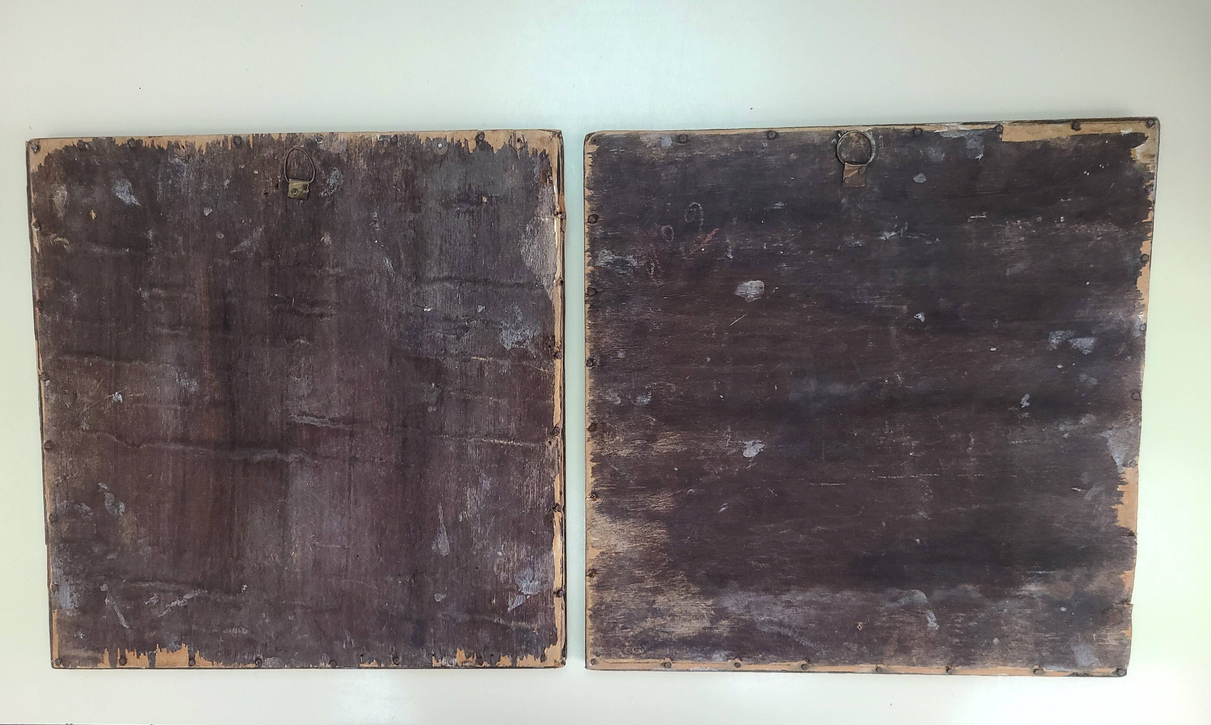 Antique tapestries framed in repoussé brass.