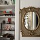 Napoleon III mirror in carved gilded wood, oval mercury glass.