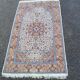 Handmade Persian rug in blue, beige, burgundy, and orange, 95x160cm.