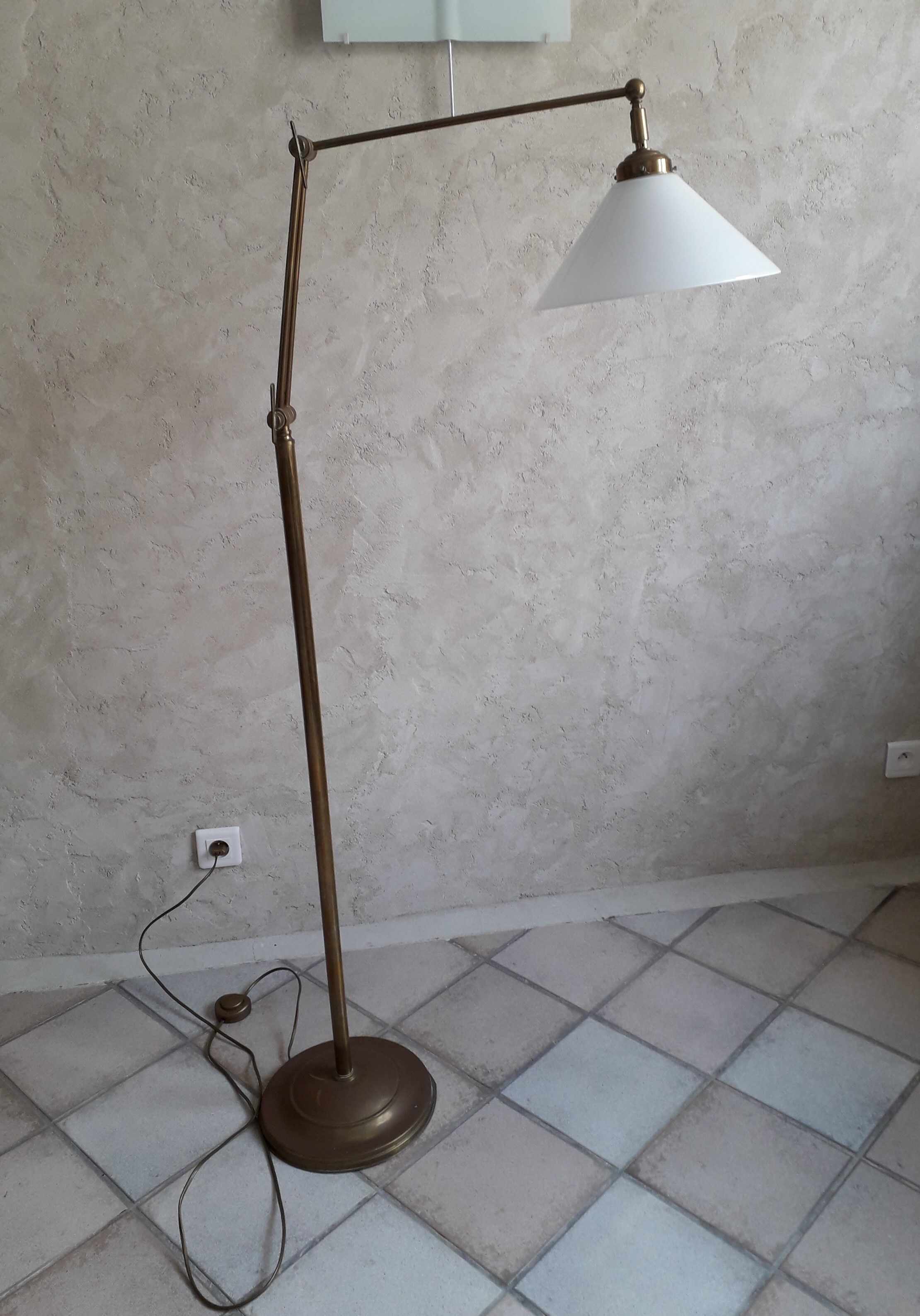 Articulated brass floor lamp