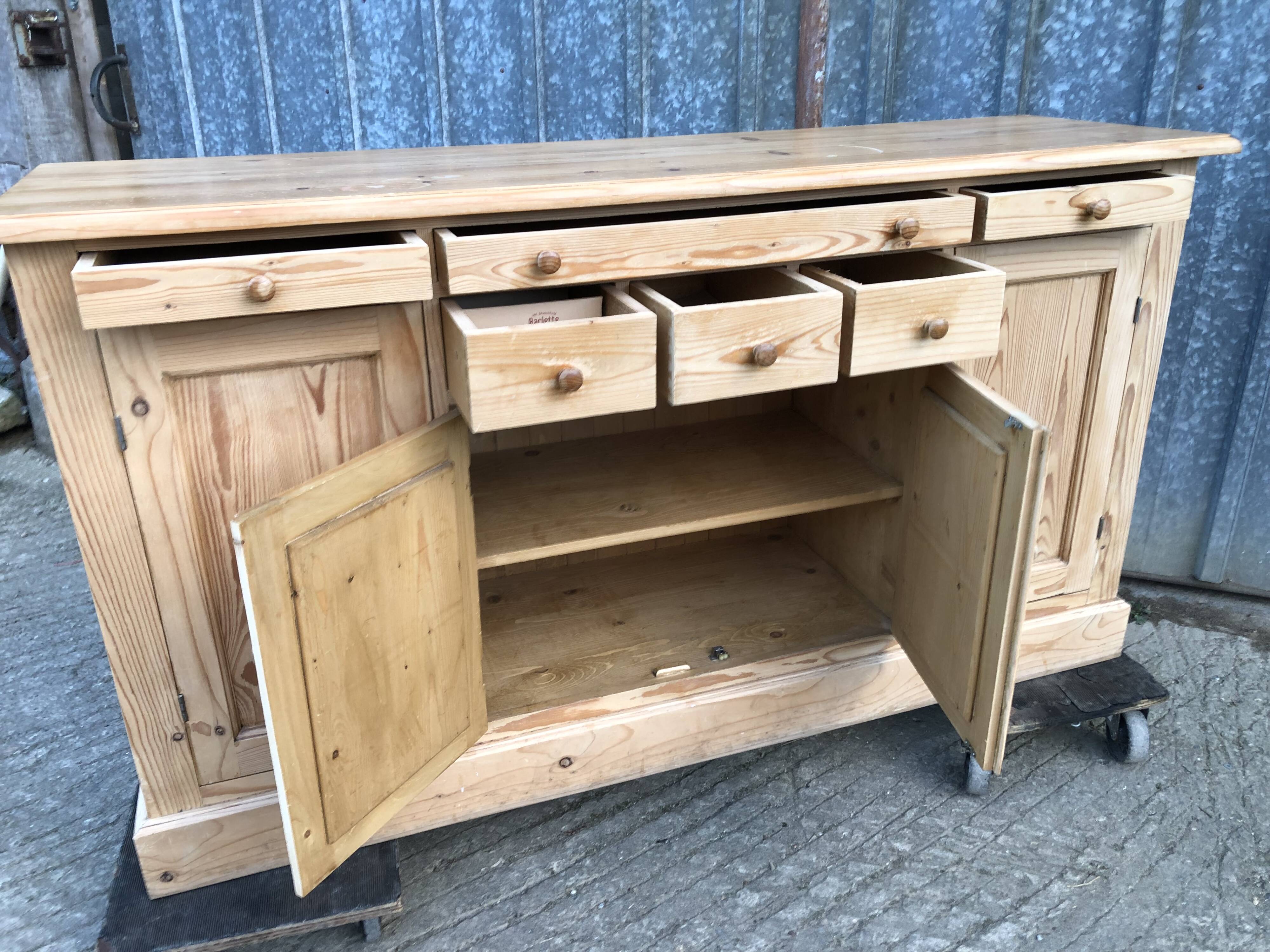 Scandinavian natural pine sideboard with 4 doors and 6 drawers.