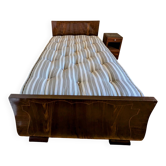Antique bed made of stamped sheet metal and its headboard