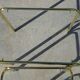 Nested table in gold metal and glass