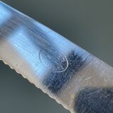 Series of 12 serrated vintage table knives