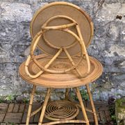 Pair of tripod coffee tables in rattan from the 1950s.