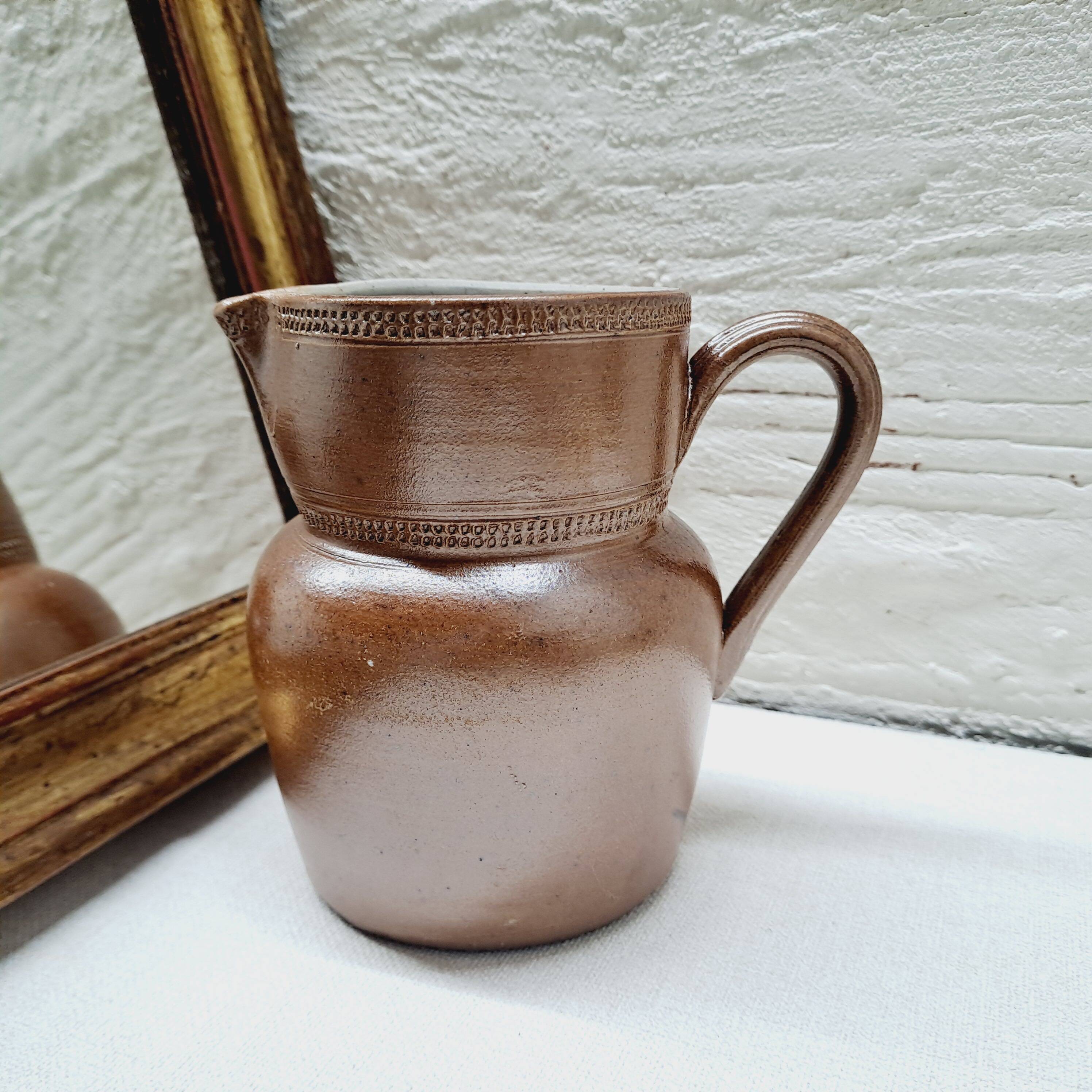 Antique stoneware milk jug