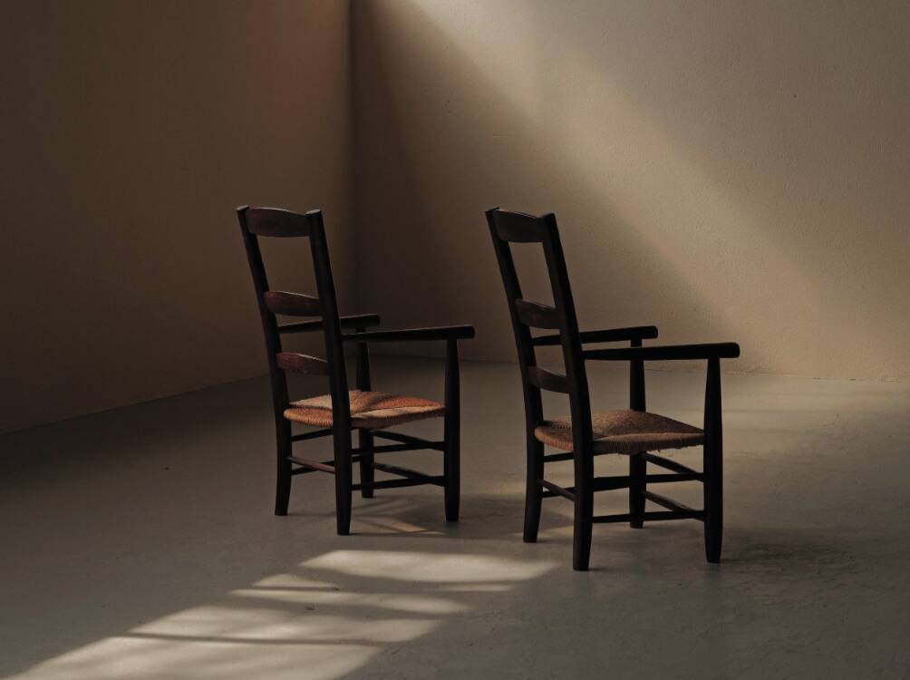 Pair of solid wood and straw armchairs, France, circa 1950.