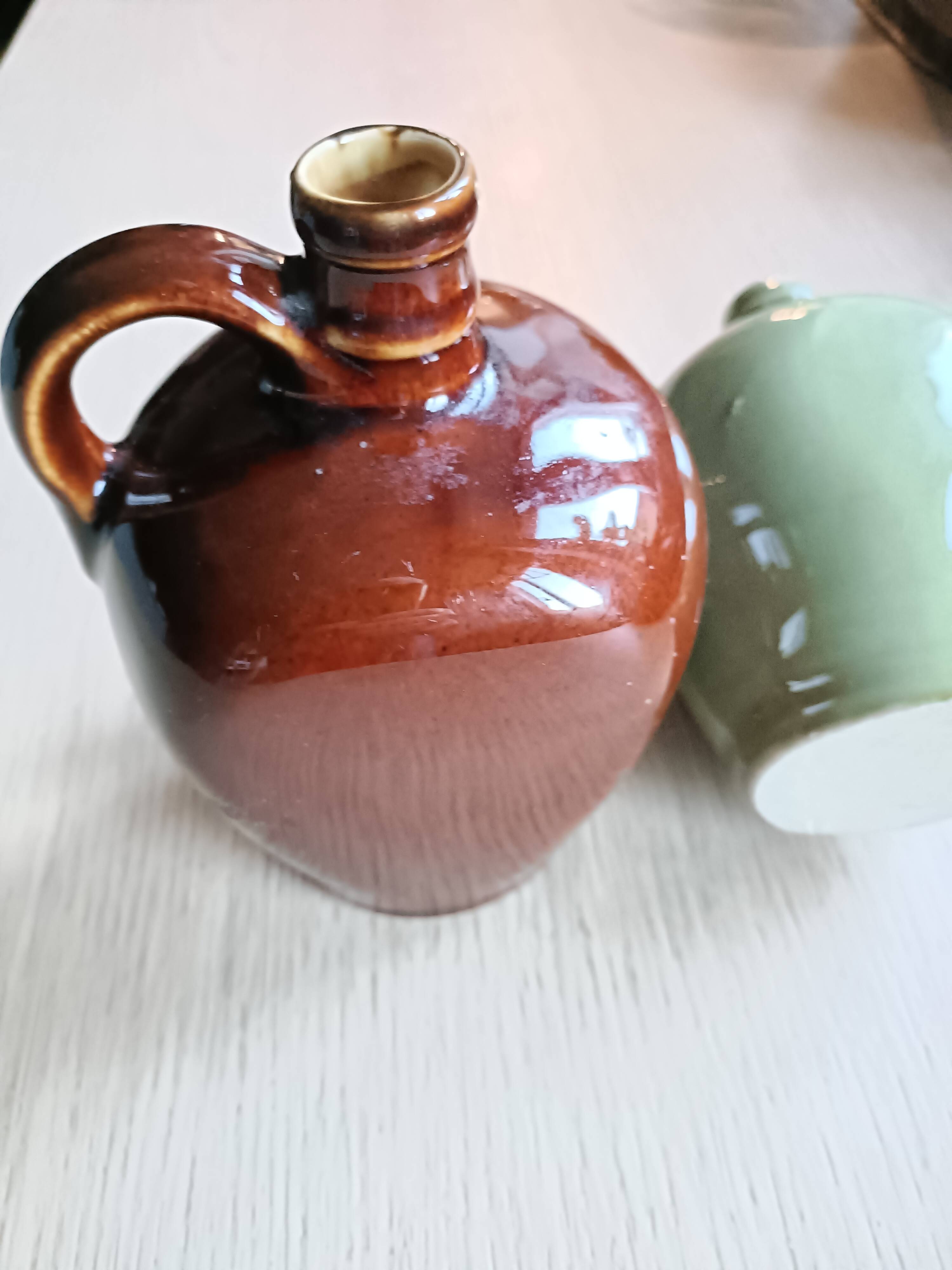 2 small glazed stoneware bottles