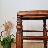 Wooden stool with cane seat