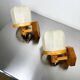 Pair of articulated "Cocoon" wall lights, resin and pine, Italy, circa 1970