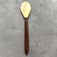 Mother-of-pearl and wood spoon
