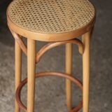 Beautiful caned stool in curved blond wood. 1940s/1950s