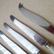 Set of 6 cheese knives and 1 Vintage Bakelite serving knives
