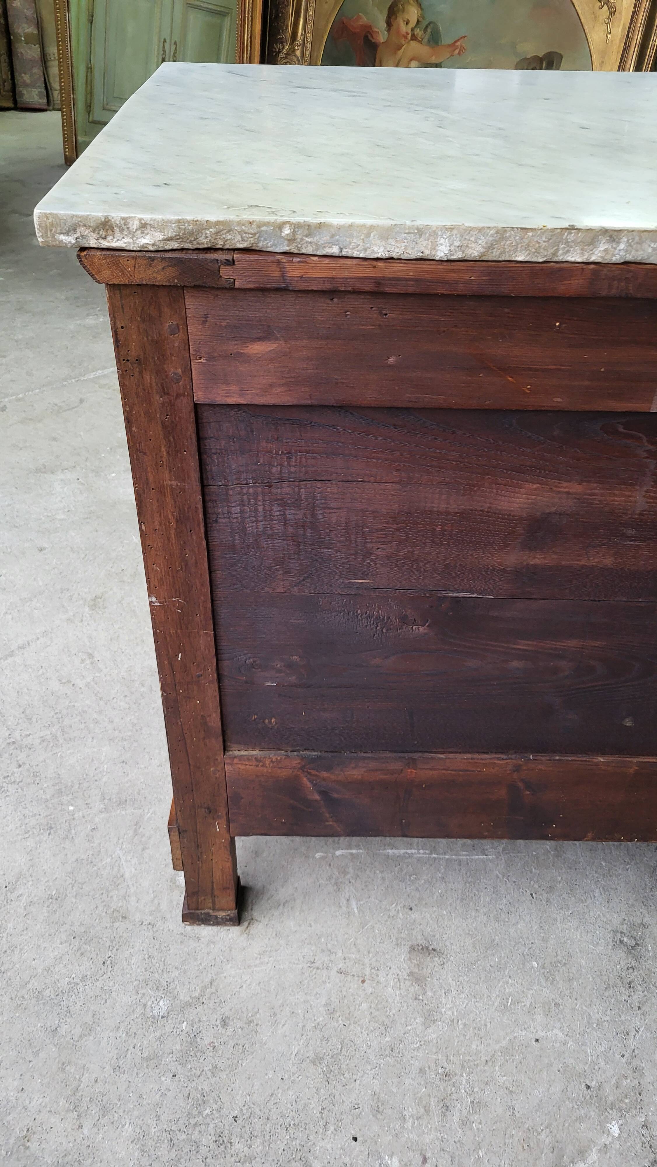 Empire commode in walnut with white marble top from the 19th century