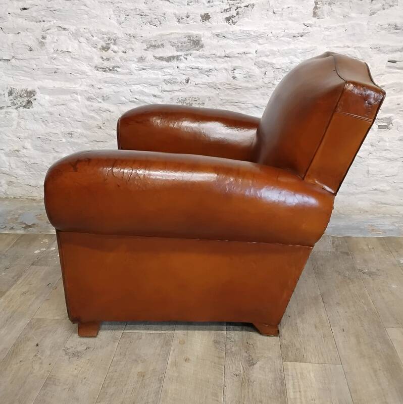Club chair with a moustache backrest