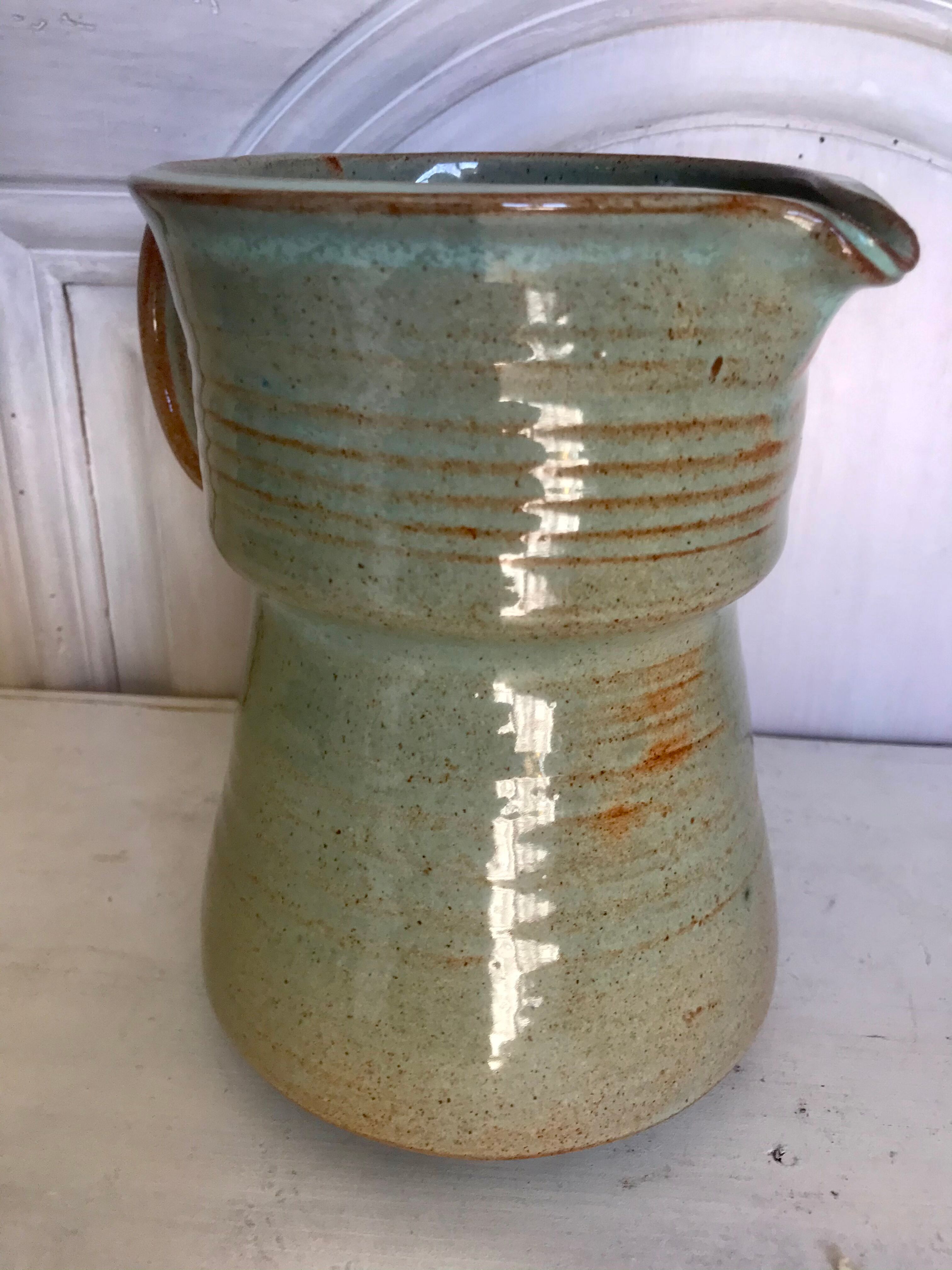 Pitcher and its vintage sandstone glasses