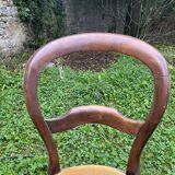 Old wooden chair with upholstered seat