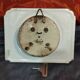 Small white art deco earthenware wall clock