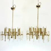 Sciolari, pair of Italian brass and glass chandeliers from 70s