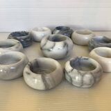 Eleven marble candlesticks