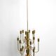 Three staged 18 arm Mid Century brass chandelier with a long brass rod