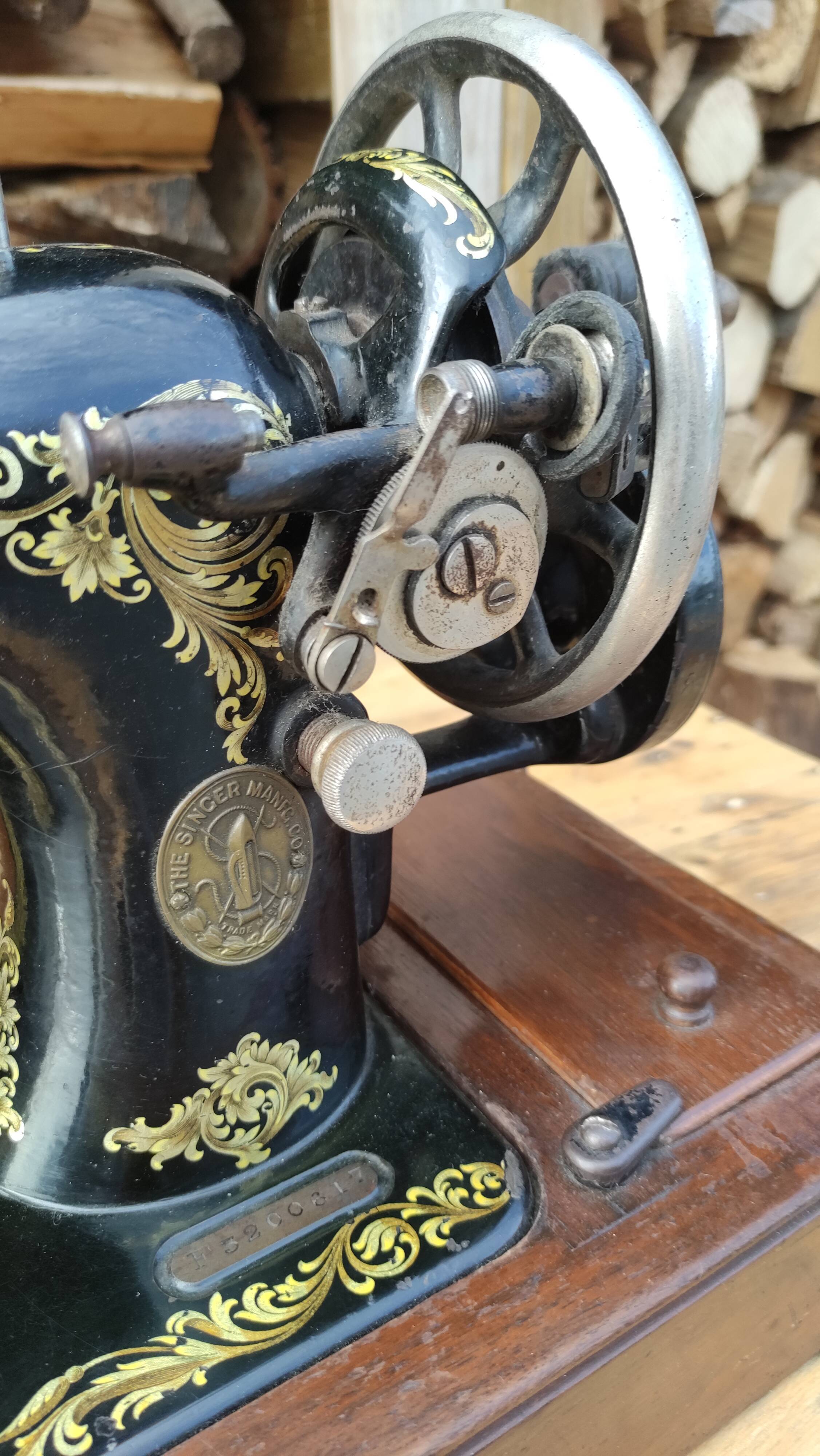 Old Singer sewing machine on its original base