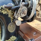 Old Singer sewing machine on its original base