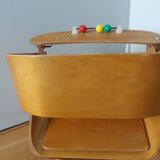 Baumann Baby Coquille children's armchair in bent wood with splayed legs.