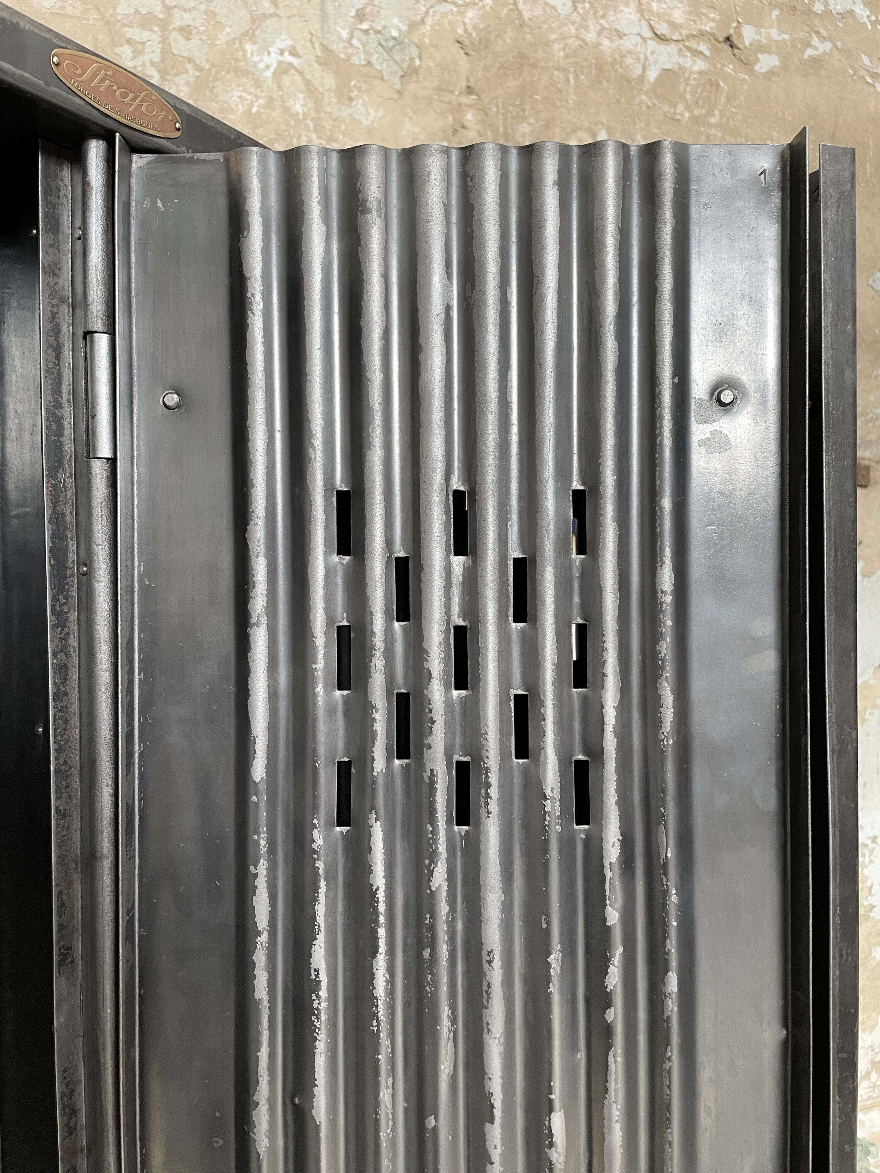 Strafor double-door corrugated iron cloakroom, circa 1920.