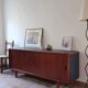 Teak enfilade, sliding doors, black faux leather top, 1970s.