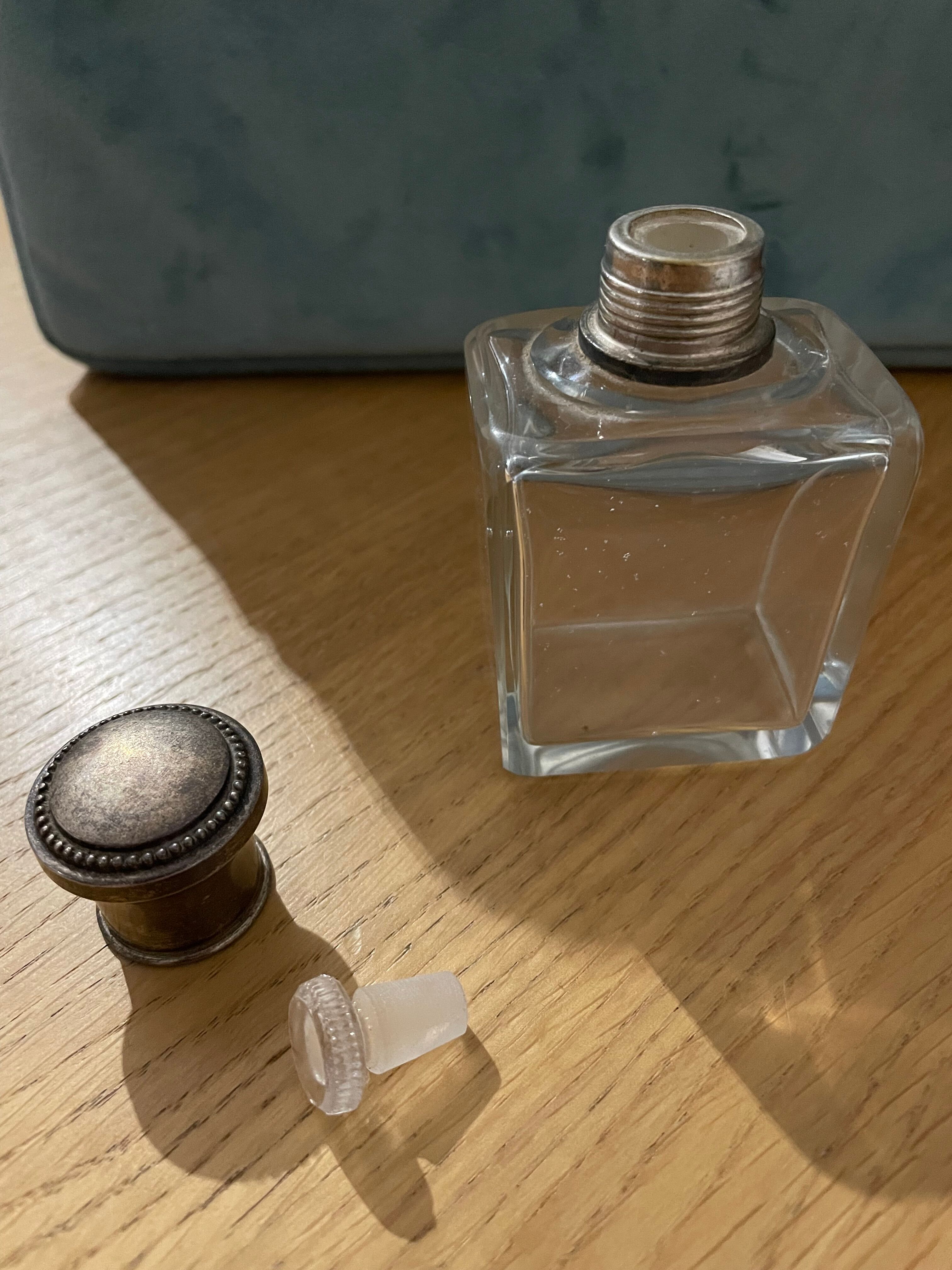 Old perfume bottle silver metal cap