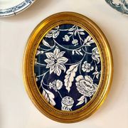Oval frame in gilded wood with domino paper Antoinette Poisson 30C "Indienne"