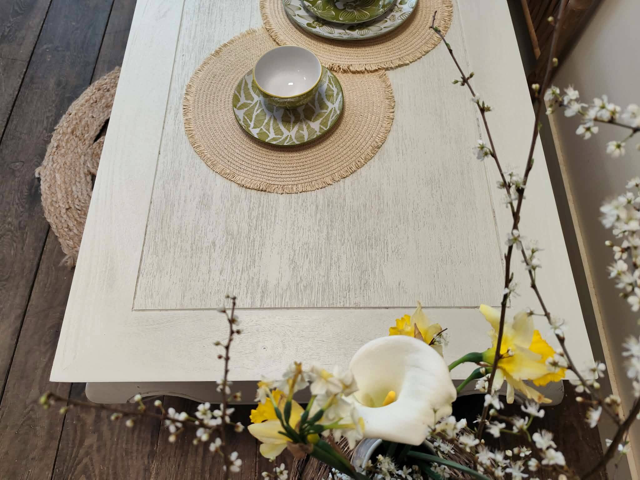 Exotic wood coffee table with its safety glass protection.