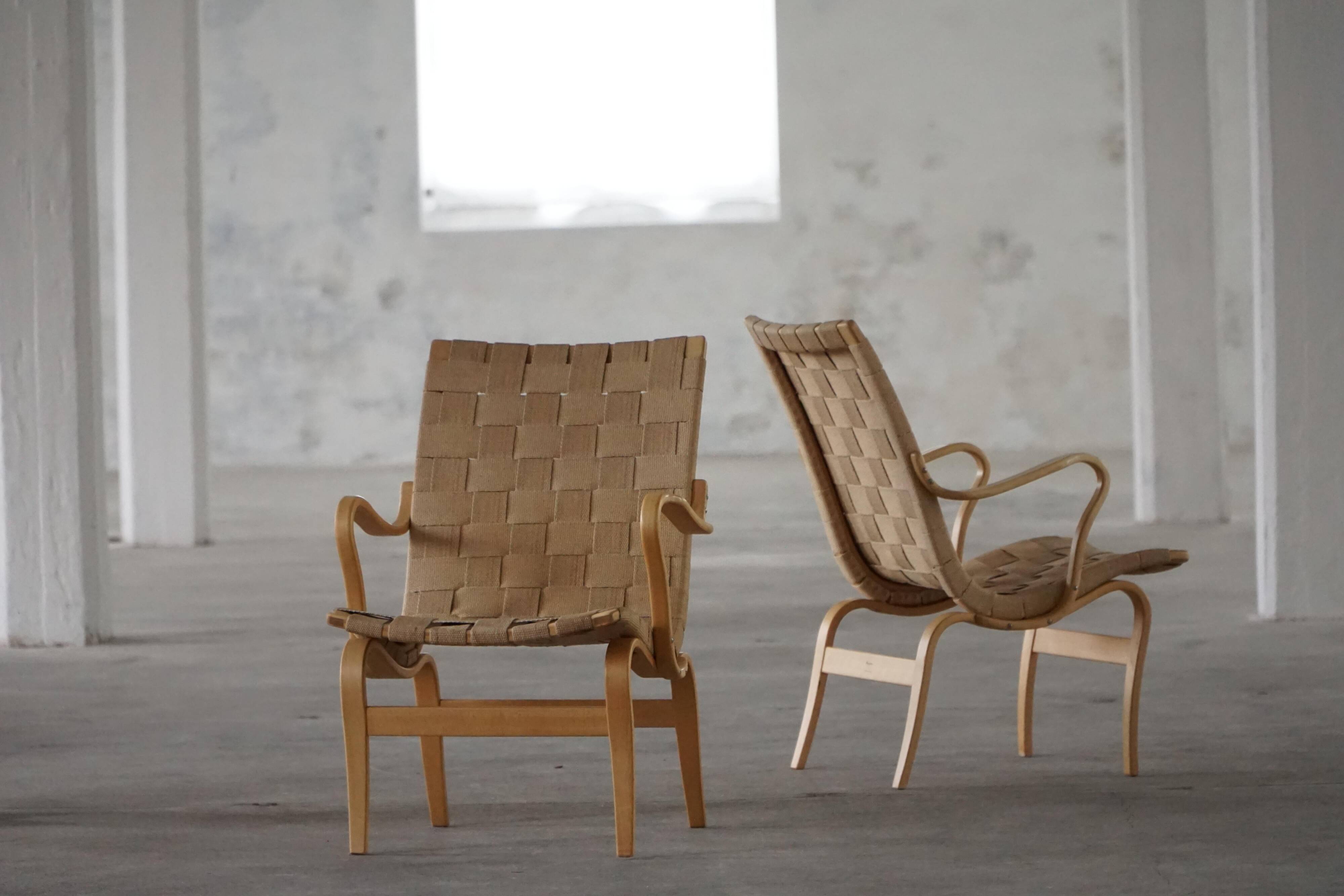 Pair of Swedish armchairs from the mid-century by Bruno Mathsson, model "Eva", 1960s.
