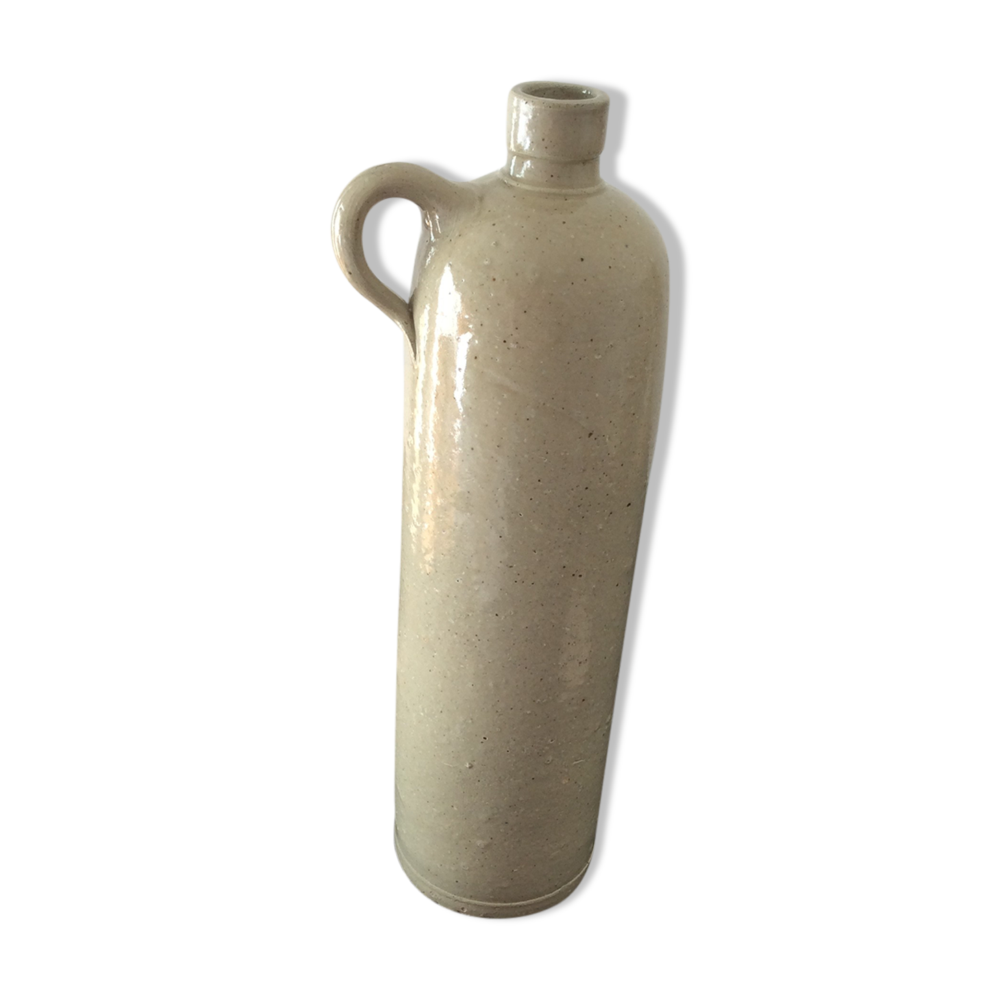 Old stoneware bottle with ear, loop