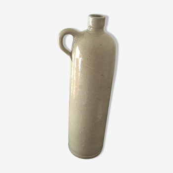 Old stoneware bottle with ear, loop