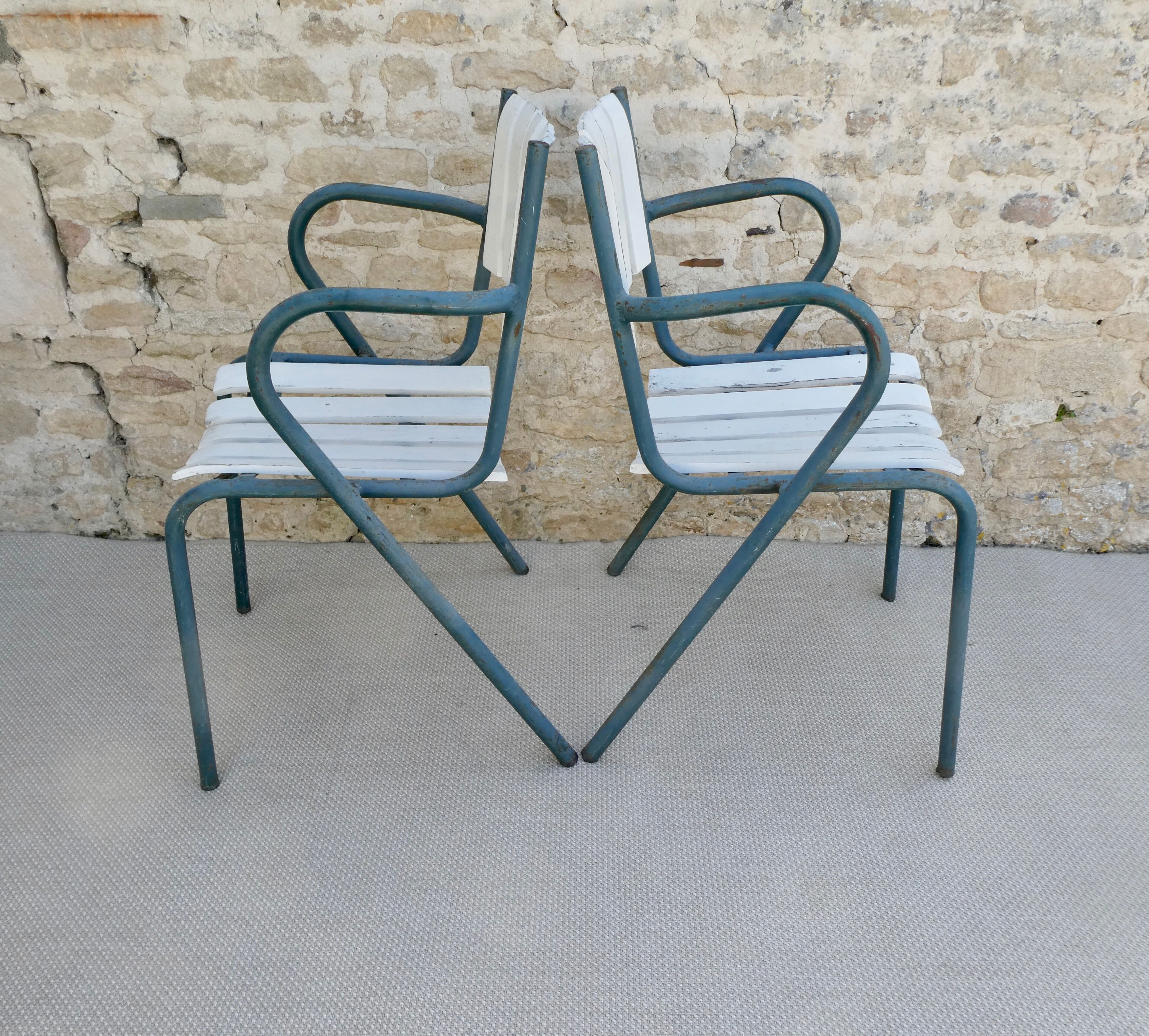 Pair of wooden and metal armchairs from the 60s