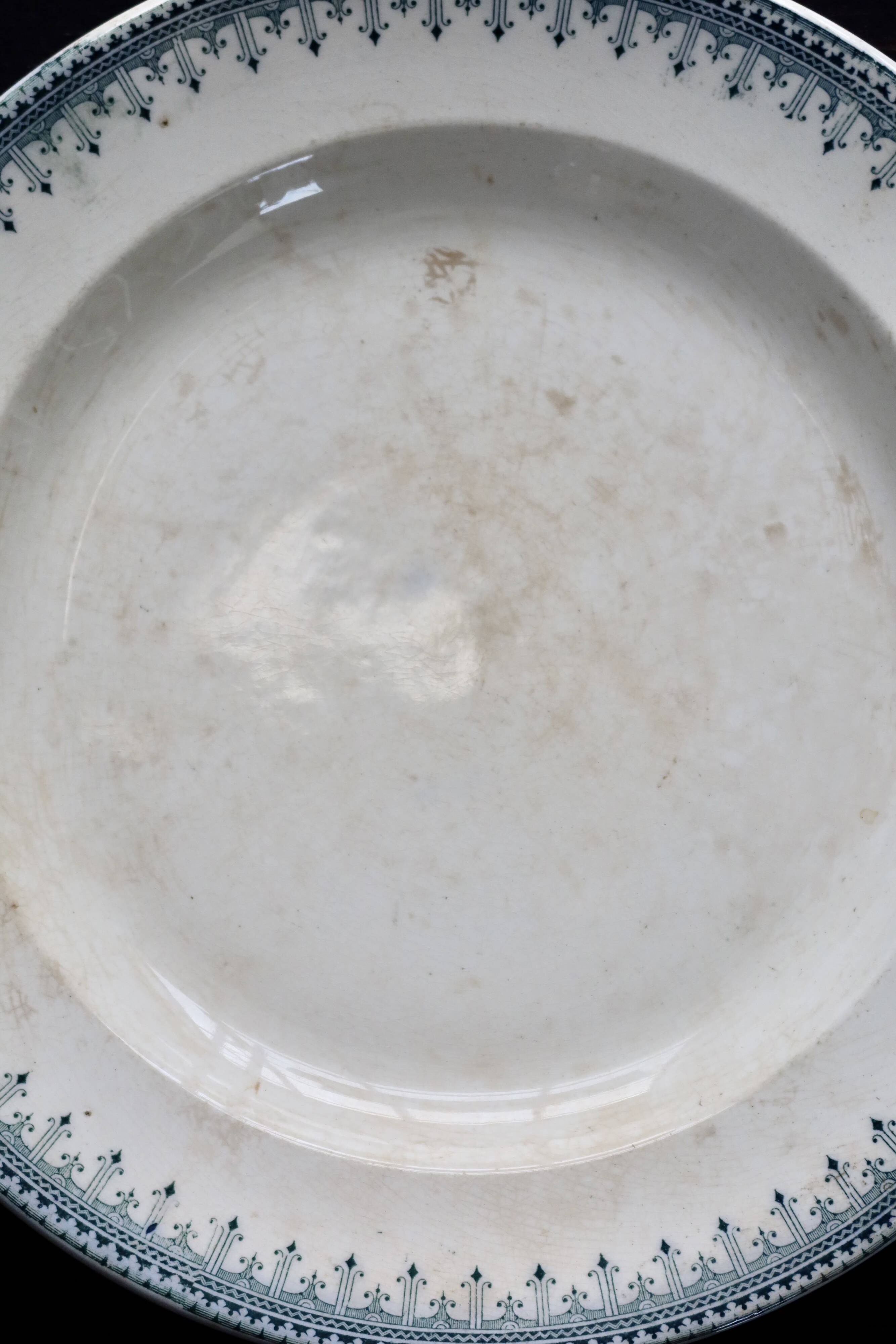 Round vintage patinated ironstone serving dish - Border model