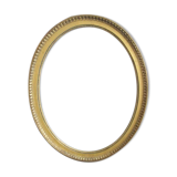 Old oval frame in gilded wood
